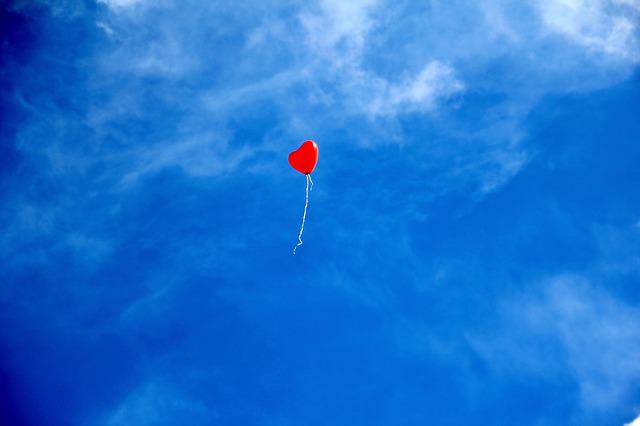 Photo of a heart-shaped balloon in the sky, from Pixabay